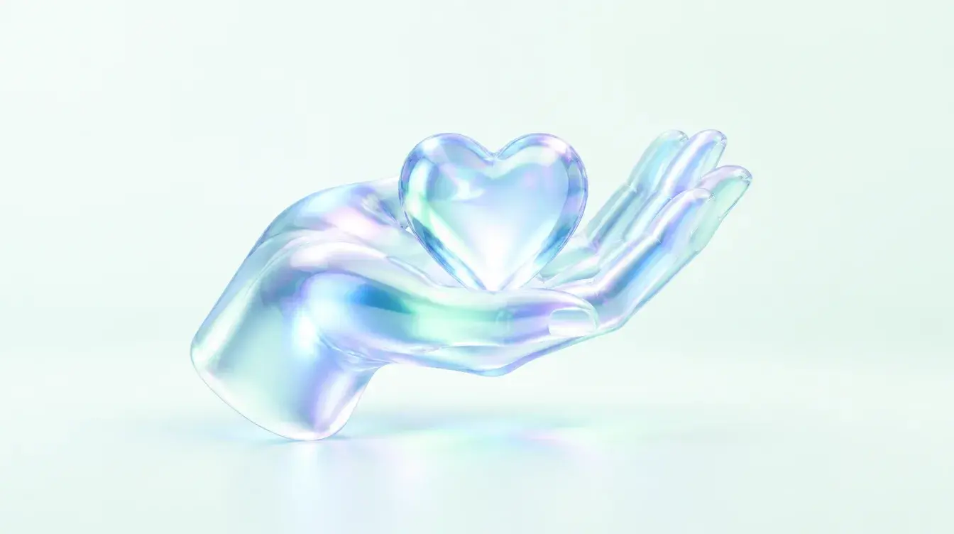 Glass hand holding a glowing heart